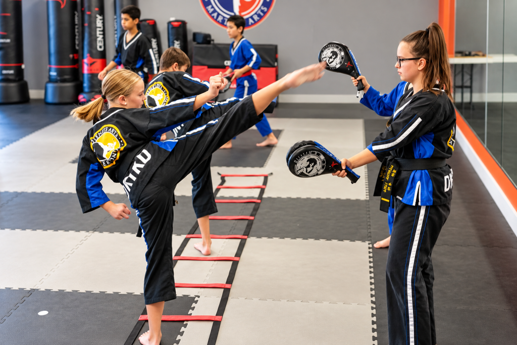 DKFA student practicing a kick during Taekwondo class.